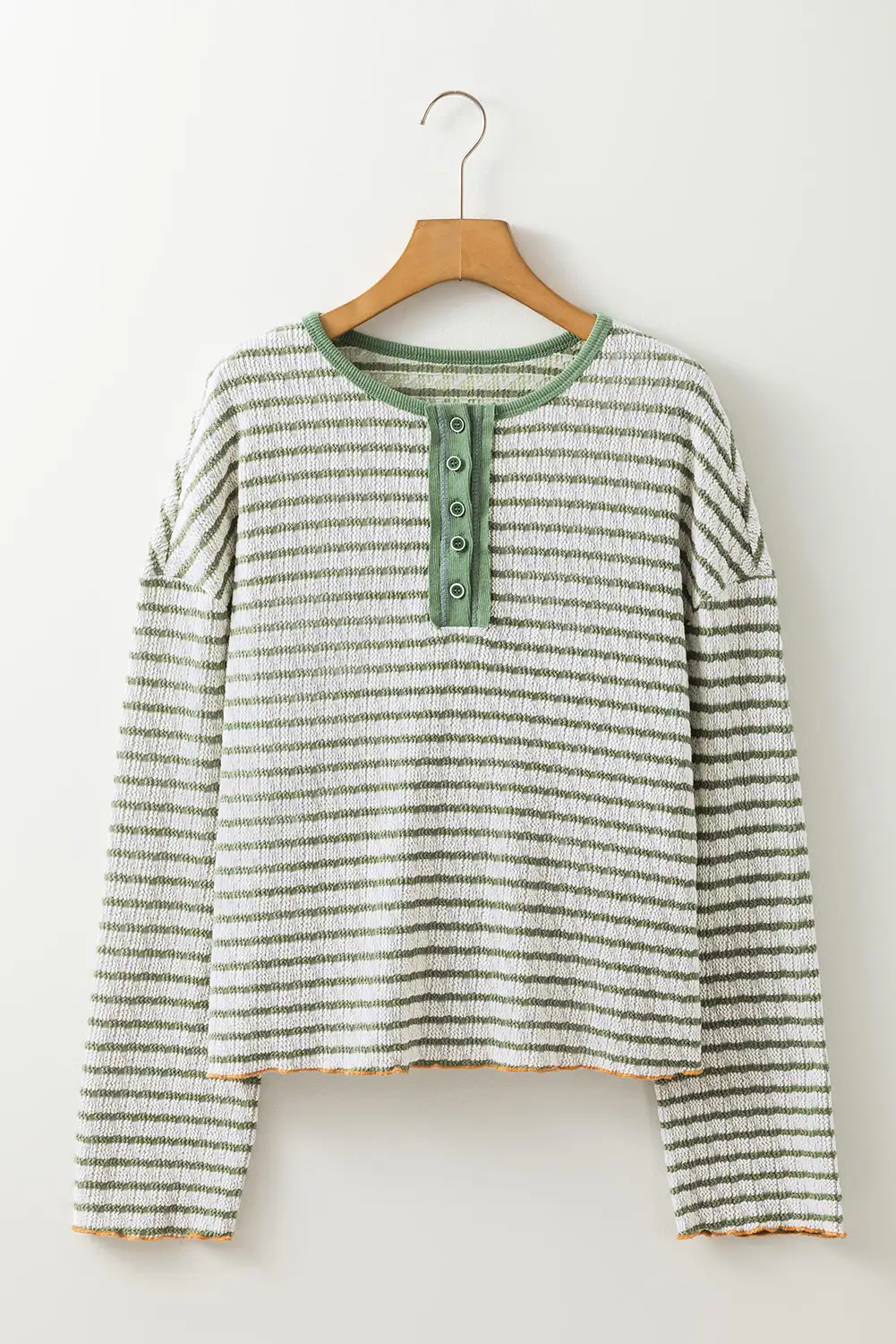 Relaxed long sleeve top styled with denim