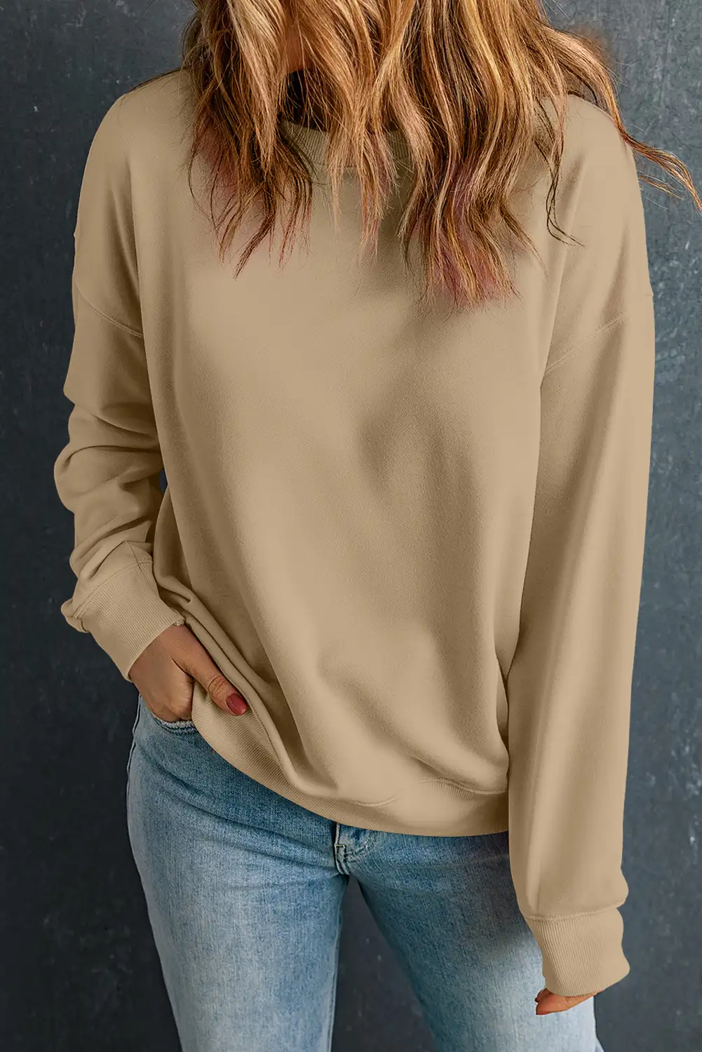 khaki crewneck sweatshirt in soft natural daylight