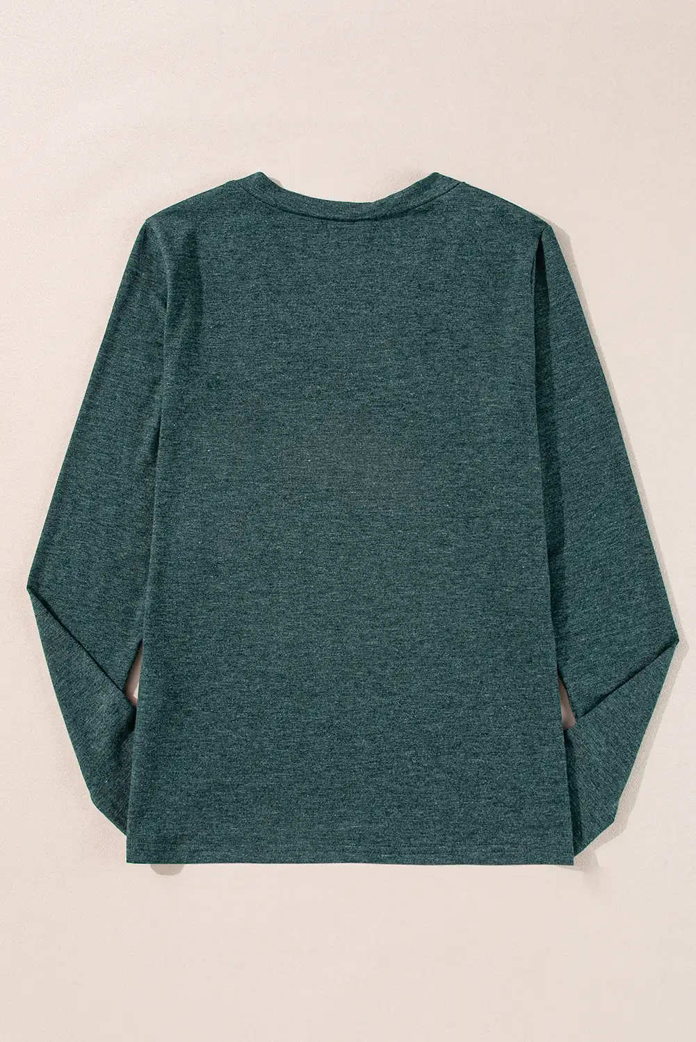 Mist green v-neck paired with everyday denim for a relaxed weekend mood