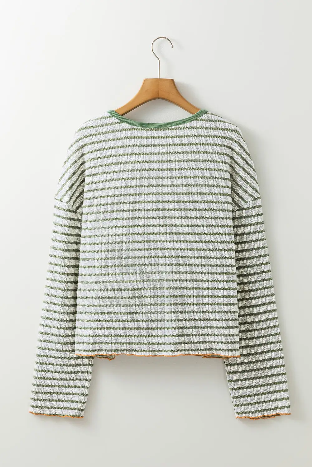 Frilly trim detail on a casual fall top