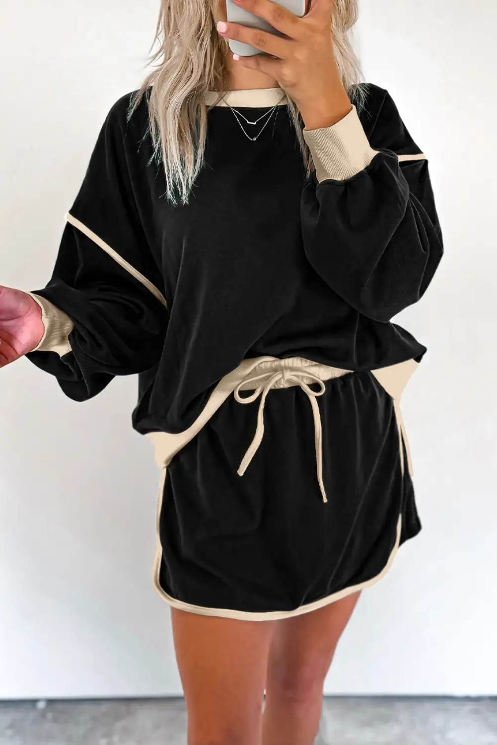 High-waist skort detail in an uncluttered studio setting