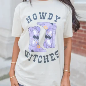 White HOWDY WITCHES Graphic Tee for Halloween with Western Boots Design Perfect for Summer Celebrations and Festive Occasions