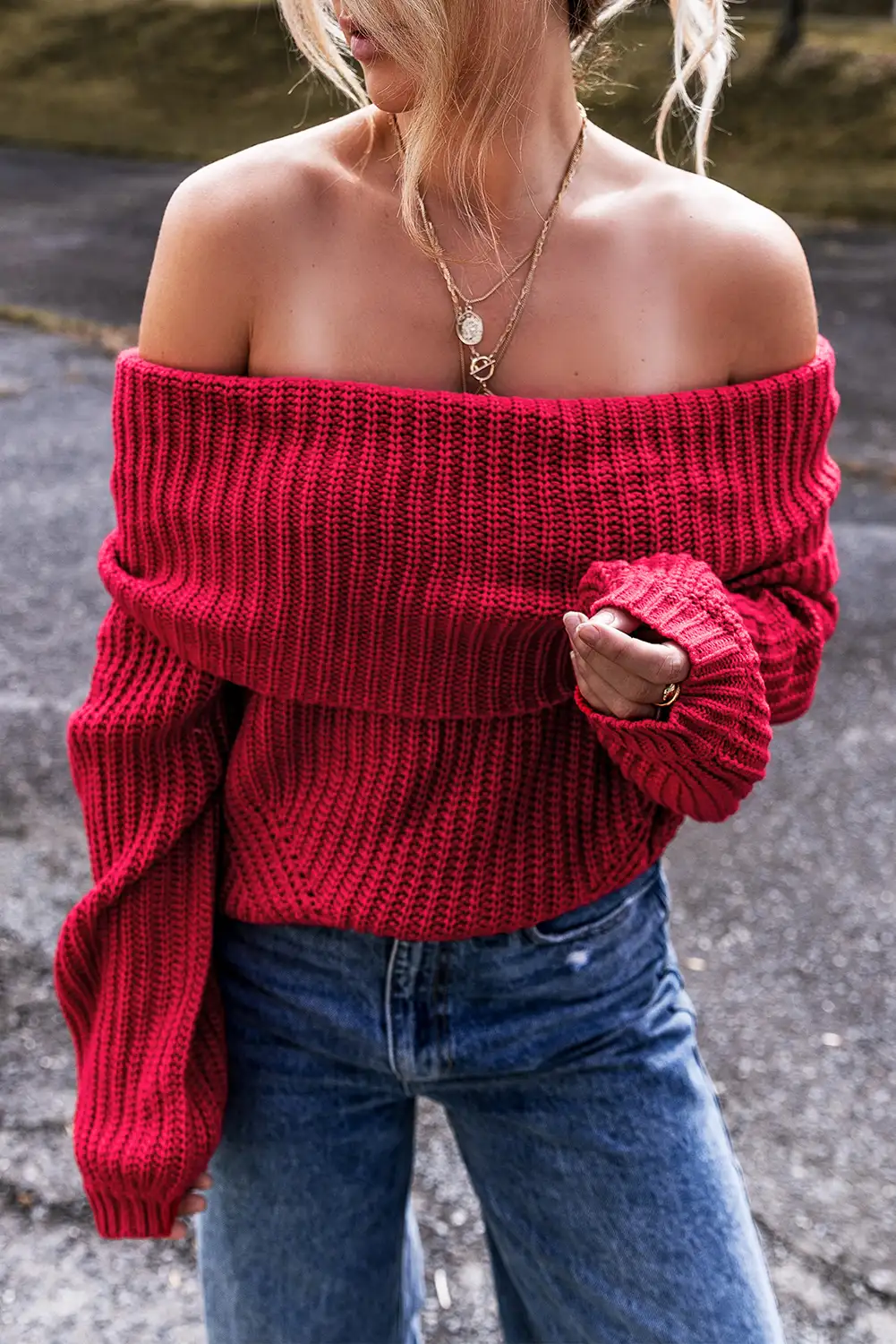 Ribbed cuff and hem detail on the racing red knit