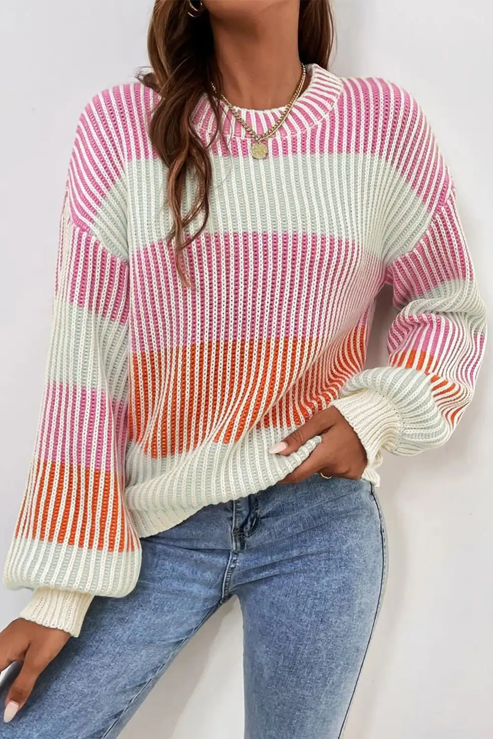 Colorblock bubble sleeve sweater worn on a relaxed winter outing