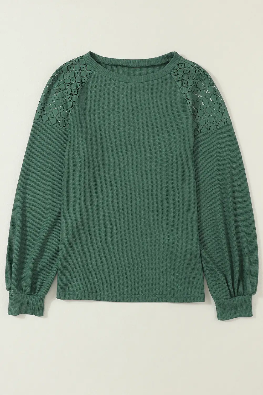 Detail of the pullover’s lace and knit pairing