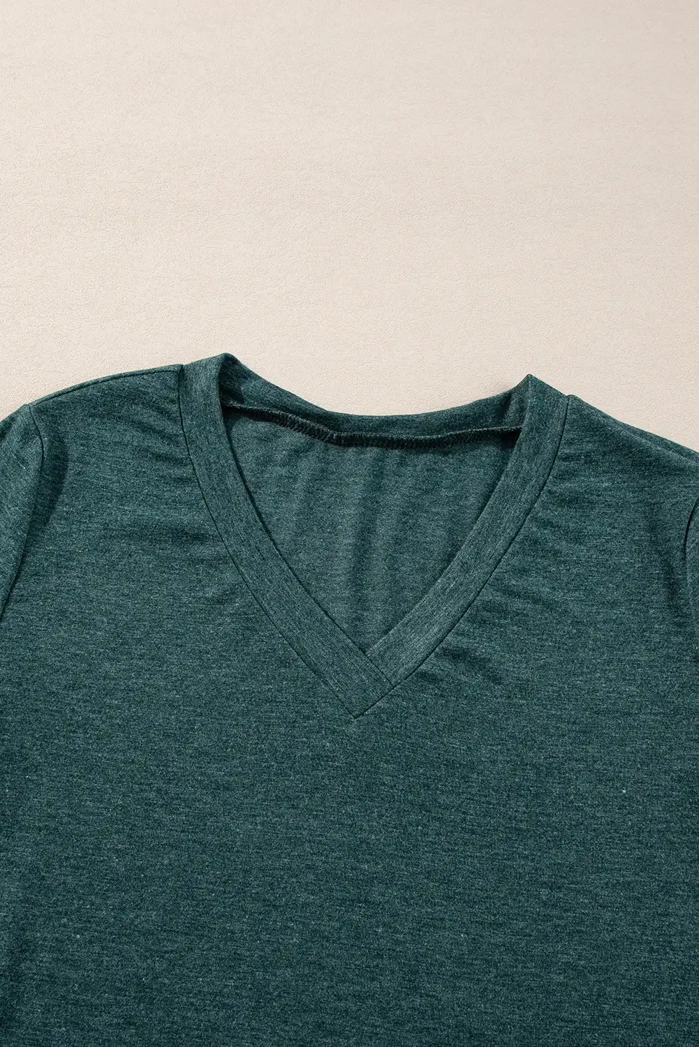 Close look at the soft drape and relaxed fit of the long-sleeve top