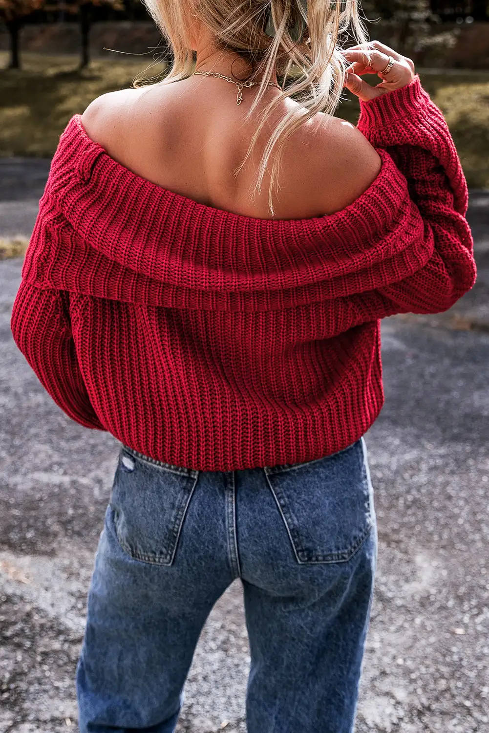 Racing red knit sweater, full look in natural daylight