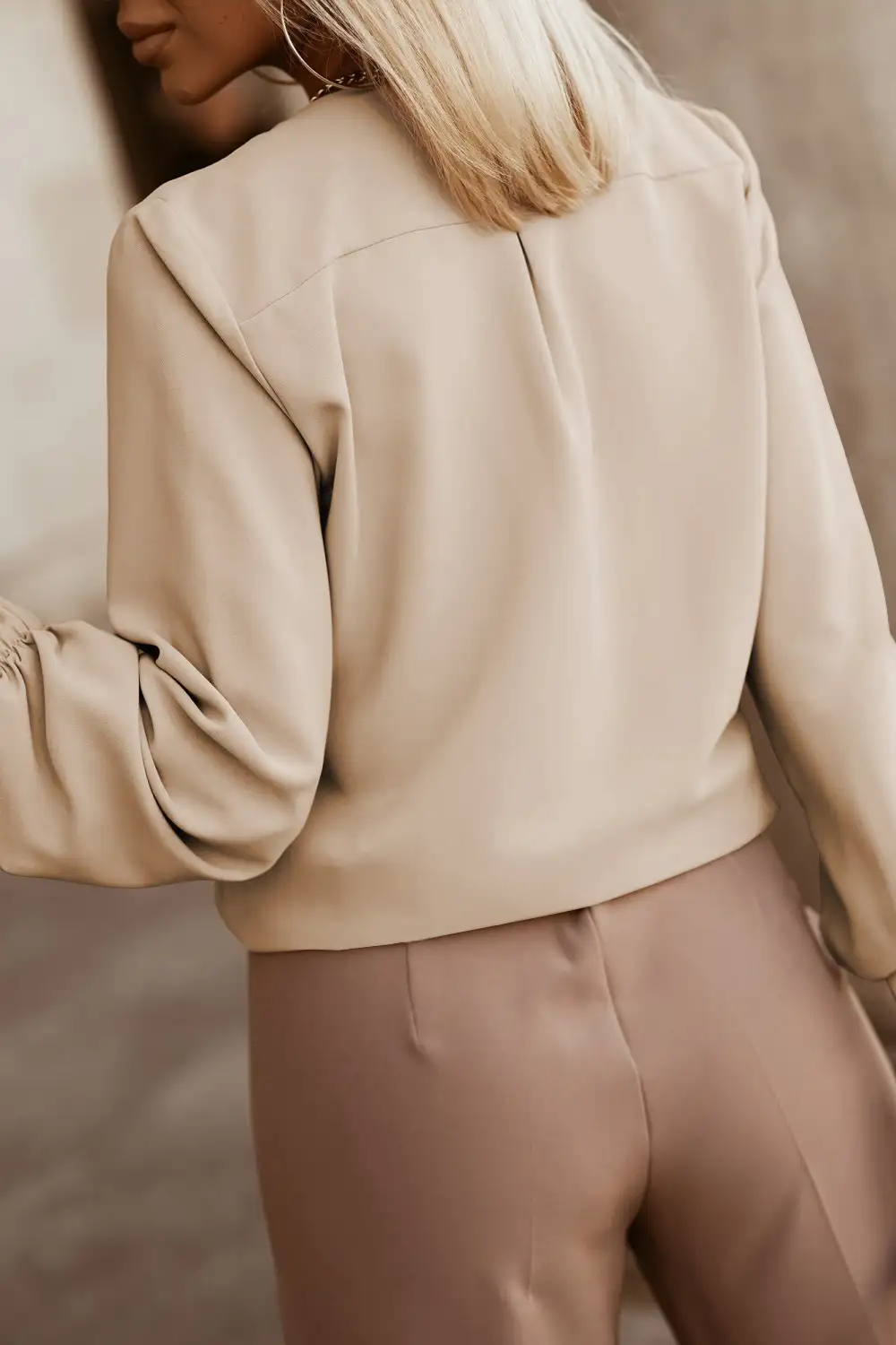 Front view of the shirt with collar pleating and a quiet placket